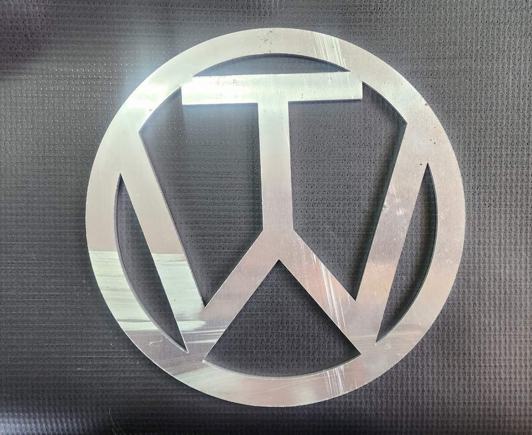 metal cut out of the TW logo