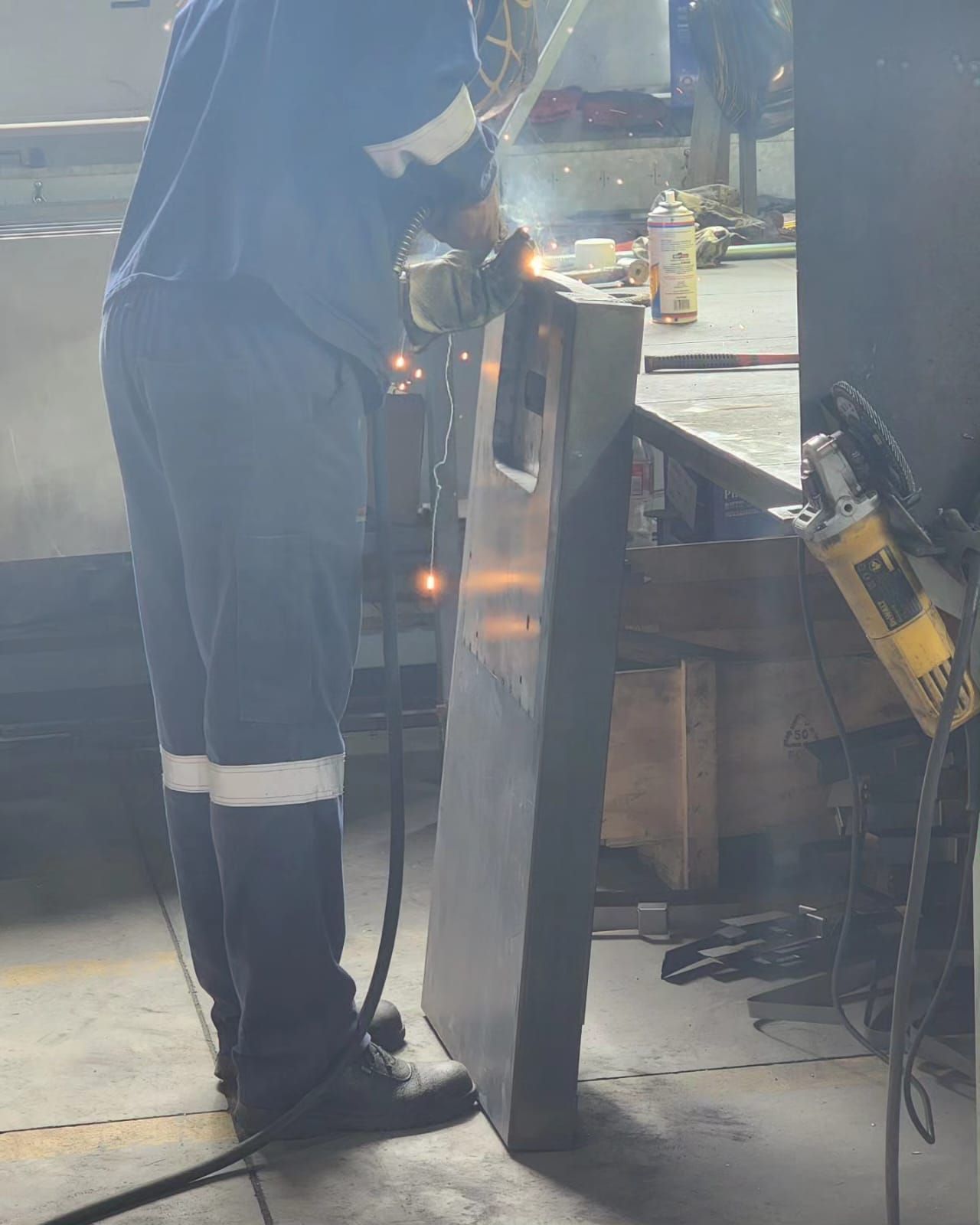 man working with metal